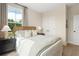 Inviting bedroom with lots of natural light, a comfortable bed, and stylish furniture at 525 Burlrush Ln # 16, Alpharetta, GA 30009