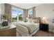 Bright bedroom with natural light, complemented by neutral tones and stylish furnishings at 525 Burlrush Ln # 16, Alpharetta, GA 30009