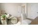 The bedroom features a comfortable green chaise, stylish chair and plenty of natural light at 525 Burlrush Ln # 16, Alpharetta, GA 30009