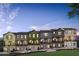 Charming townhomes with varied colors, brick accents, and inviting front entrances, landscaped for curb appeal at 525 Burlrush Ln # 16, Alpharetta, GA 30009