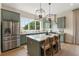 Gourmet kitchen with stainless steel appliances, large island, and designer fixtures at 525 Burlrush Ln # 16, Alpharetta, GA 30009
