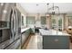 Spacious kitchen with stainless steel appliances, a center island, and light countertops at 525 Burlrush Ln # 16, Alpharetta, GA 30009