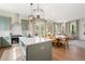 Kitchen features a large island, stainless appliances, and views to the living room at 525 Burlrush Ln # 16, Alpharetta, GA 30009