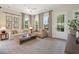 Comfortable living room with neutral furniture, large windows, and stylish decor with a view to the outside at 525 Burlrush Ln # 16, Alpharetta, GA 30009