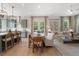 Open-concept living area featuring a modern kitchen, dining space, and a comfortable seating area with natural light at 525 Burlrush Ln # 16, Alpharetta, GA 30009