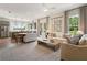 Open floor plan featuring a modern kitchen, dining area, and a cozy living room filled with natural light at 525 Burlrush Ln # 16, Alpharetta, GA 30009