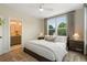 Well-lit main bedroom featuring a bathroom entrance and two large windows at 525 Burlrush Ln # 16, Alpharetta, GA 30009