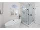 Bright bathroom with a soaking tub, glass-enclosed shower, and elegant finishes at 2914 Stanway Ave, Douglasville, GA 30135