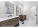 Bathroom with double vanity, quartz countertops, wood drawers and cabinets, and modern fixtures at 2914 Stanway Ave, Douglasville, GA 30135