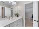 Bathroom with a long vanity, a mirror, and an open doorway at 2914 Stanway Ave, Douglasville, GA 30135