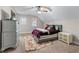 Cozy bedroom with neutral walls and carpet, complemented by a ceiling fan and a plush rug at 2914 Stanway Ave, Douglasville, GA 30135