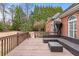 Well-maintained wooden deck with wicker seating area, perfect for outdoor enjoyment at 2914 Stanway Ave, Douglasville, GA 30135