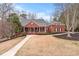 Charming brick home featuring a well-manicured lawn, covered porch, and inviting curb appeal at 2914 Stanway Ave, Douglasville, GA 30135