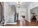 Elegant foyer with hardwood floors, staircase, and views into the adjacent living spaces at 2914 Stanway Ave, Douglasville, GA 30135