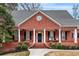 Classic brick facade with white columns accenting the covered front porch and black shutters at 2914 Stanway Ave, Douglasville, GA 30135