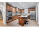 Spacious kitchen with wooden cabinets, stainless steel appliances, and a center island with seating at 2914 Stanway Ave, Douglasville, GA 30135