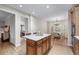 Open kitchen featuring a center island, hardwood floors, and adjacent breakfast nook at 2914 Stanway Ave, Douglasville, GA 30135