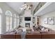 Bright and airy living room with high ceilings, fireplace, built-in shelves, and expansive windows at 2914 Stanway Ave, Douglasville, GA 30135