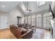 Spacious living room with a comfortable sectional sofa, fireplace, and ample natural light at 2914 Stanway Ave, Douglasville, GA 30135