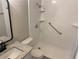Bathroom featuring new vanity and step-in shower with safety bar and recessed shelves at 3228 Shadow Walk Ln, Tucker, GA 30084