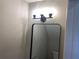 Charming bathroom featuring modern lighting fixture, stylish framed mirror, and granite countertop vanity at 3228 Shadow Walk Ln, Tucker, GA 30084