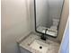 Modern bathroom featuring a granite countertop, sleek faucet, and a stylish framed mirror at 3228 Shadow Walk Ln, Tucker, GA 30084