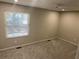 Bright bedroom with a window letting in natural light, complemented by a modern ceiling fan at 3228 Shadow Walk Ln, Tucker, GA 30084