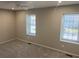 Spacious bedroom with two windows for natural light and neutral carpeting at 3228 Shadow Walk Ln, Tucker, GA 30084