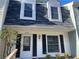 Close-up of a well-maintained townhome with a dark roof and freshly painted siding at 3228 Shadow Walk Ln, Tucker, GA 30084