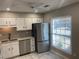 Modern kitchen with stainless steel appliances, granite countertops and a stainless steel sink at 3228 Shadow Walk Ln, Tucker, GA 30084