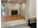 Inviting living room with fireplace, wood floors, and sliding glass doors to the patio at 3228 Shadow Walk Ln, Tucker, GA 30084