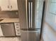 Stainless steel refrigerator with a built-in ice and water dispenser in a modern kitchen at 3228 Shadow Walk Ln, Tucker, GA 30084