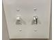 Close-up of a double light switch with labels indicating on and off positions at 3228 Shadow Walk Ln, Tucker, GA 30084