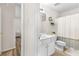 Bathroom with a clean white vanity, toilet, and bathtub-shower combination, maximizing space efficiency at 502 Stoneland Pl, Lawrenceville, GA 30046