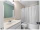 Clean bathroom features white vanity, toilet, and tub-shower, offering a functional and bright space at 502 Stoneland Pl, Lawrenceville, GA 30046