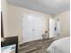 Bedroom showcasing a closet and stylish flooring with a bright and airy feel at 502 Stoneland Pl, Lawrenceville, GA 30046