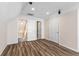 Bonus room with white trim, and wood laminate flooring, providing a flexible area at 502 Stoneland Pl, Lawrenceville, GA 30046
