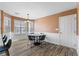 Bright dining area featuring an eat in table with seating, large windows and an entry door at 502 Stoneland Pl, Lawrenceville, GA 30046