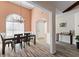 Elegant dining room with high ceilings, a chandelier, and views into the adjacent living spaces at 502 Stoneland Pl, Lawrenceville, GA 30046