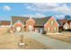 Beautiful brick home featuring a two-car garage, well-kept lawn, and a classic roof design at 502 Stoneland Pl, Lawrenceville, GA 30046