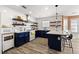 Kitchen featuring white backsplash, a large island, stainless steel appliances, and eat in kitchen at 502 Stoneland Pl, Lawrenceville, GA 30046