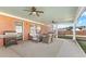 Covered patio with ceiling fans, grill, outdoor seating, and a well-maintained concrete floor at 502 Stoneland Pl, Lawrenceville, GA 30046
