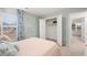 Bedroom featuring neutral walls, closet and a window with floral curtains at 5429 Flat Rock Point, Stonecrest, GA 30038