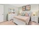 Bright bedroom featuring a bed with stylish decor, dresser, and nightstand at 5429 Flat Rock Point, Stonecrest, GA 30038