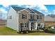 Beautiful two-story home with brick and siding, complemented by lush landscaping at 5429 Flat Rock Point, Stonecrest, GA 30038