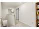 Upstairs hallway with neutral paint, carpet, and a view of the stairs at 5429 Flat Rock Point, Stonecrest, GA 30038