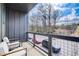 Outdoor balcony provides views of the surrounding neighborhood, seating, and shade at 944 Spencer Ave, Atlanta, GA 30318