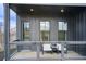 Cozy outdoor balcony with seating is a great space for entertaining at 944 Spencer Ave, Atlanta, GA 30318