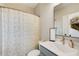 Bathroom with a white vanity, patterned shower curtain, and modern fixtures at 944 Spencer Ave, Atlanta, GA 30318