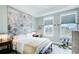 Stylish bedroom with large windows, tray ceiling, and decorative mountain mural at 944 Spencer Ave, Atlanta, GA 30318